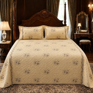 Imported velvet embroidered beige bedsheet set with two matching pillow covers featuring elegant quilted embroidery and luxury bedroom styling.