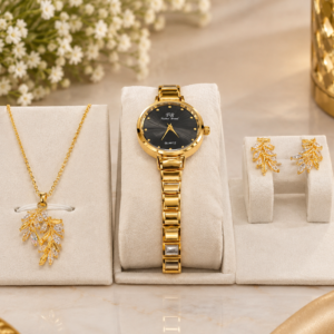 Luxury gold watch and jewelry set featuring a black dial watch, leaf pendant necklace and matching earrings