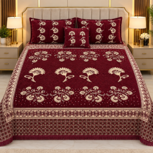 Velvet Jacquard 4 piece bed setup in rich maroon and cream featuring a floral patterned bedsheet, matching pillow covers, and decorative cushion.